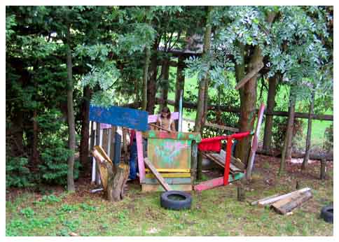 Children playing in self-build structures