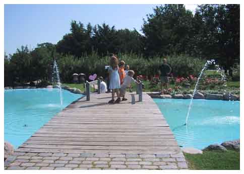 Children on a bridge across water
